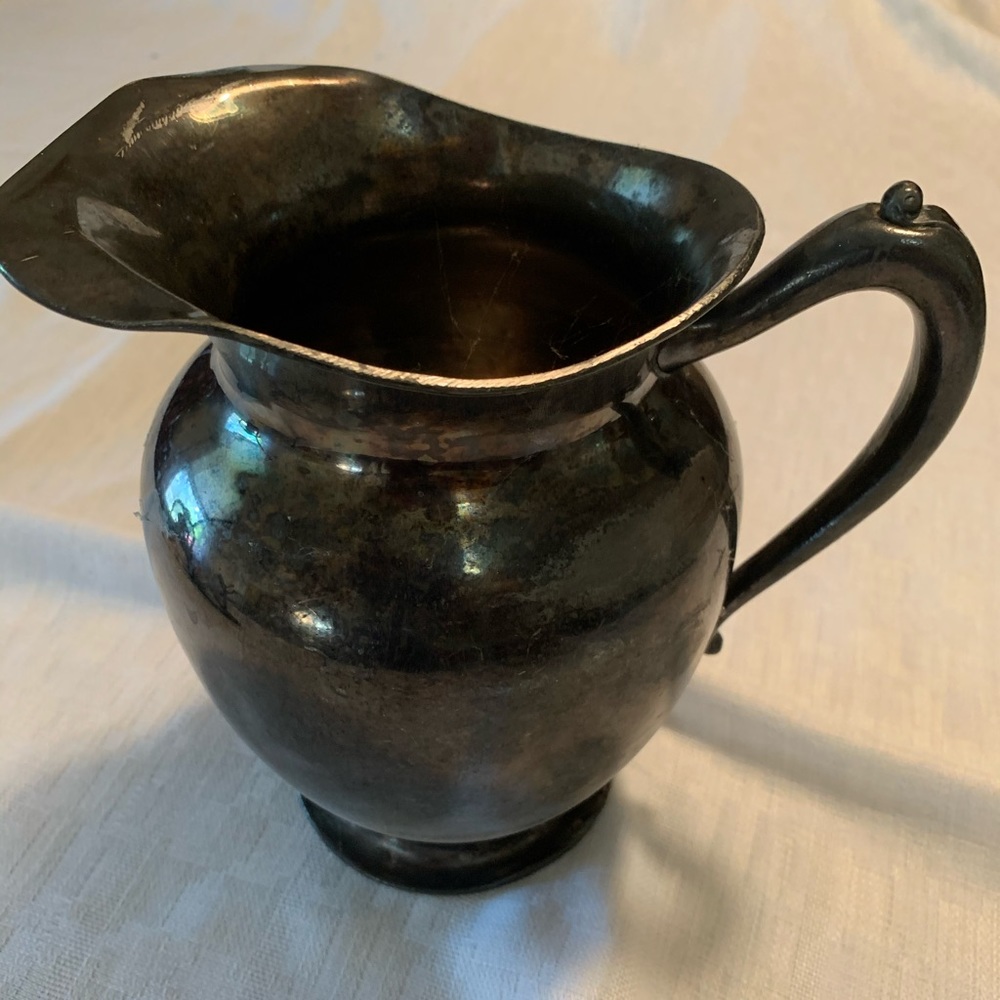 This is an antique water pitcher EPBM WR Canada